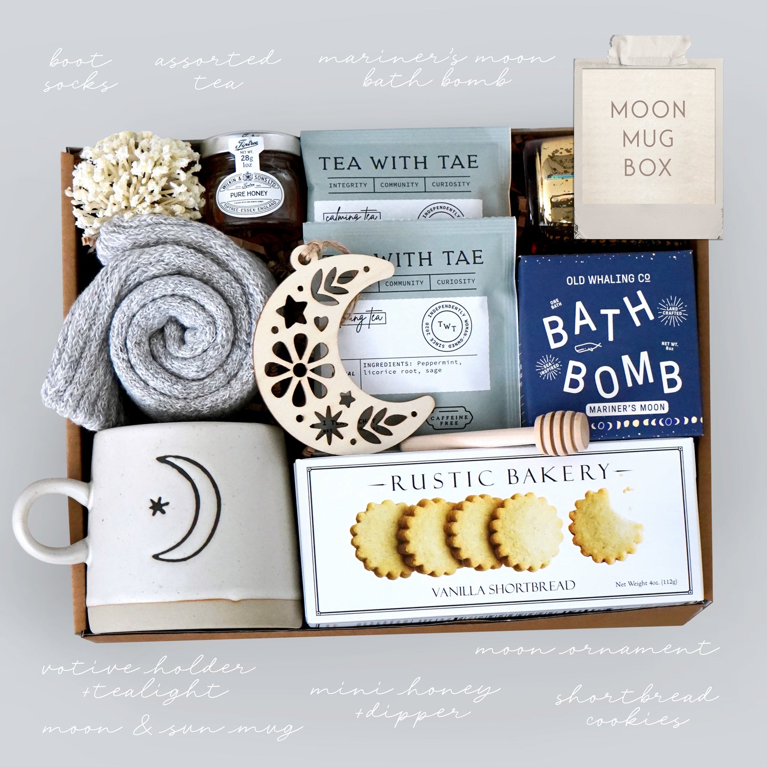 Gift box with bath-themed items including a mug, cookies, and bath products.