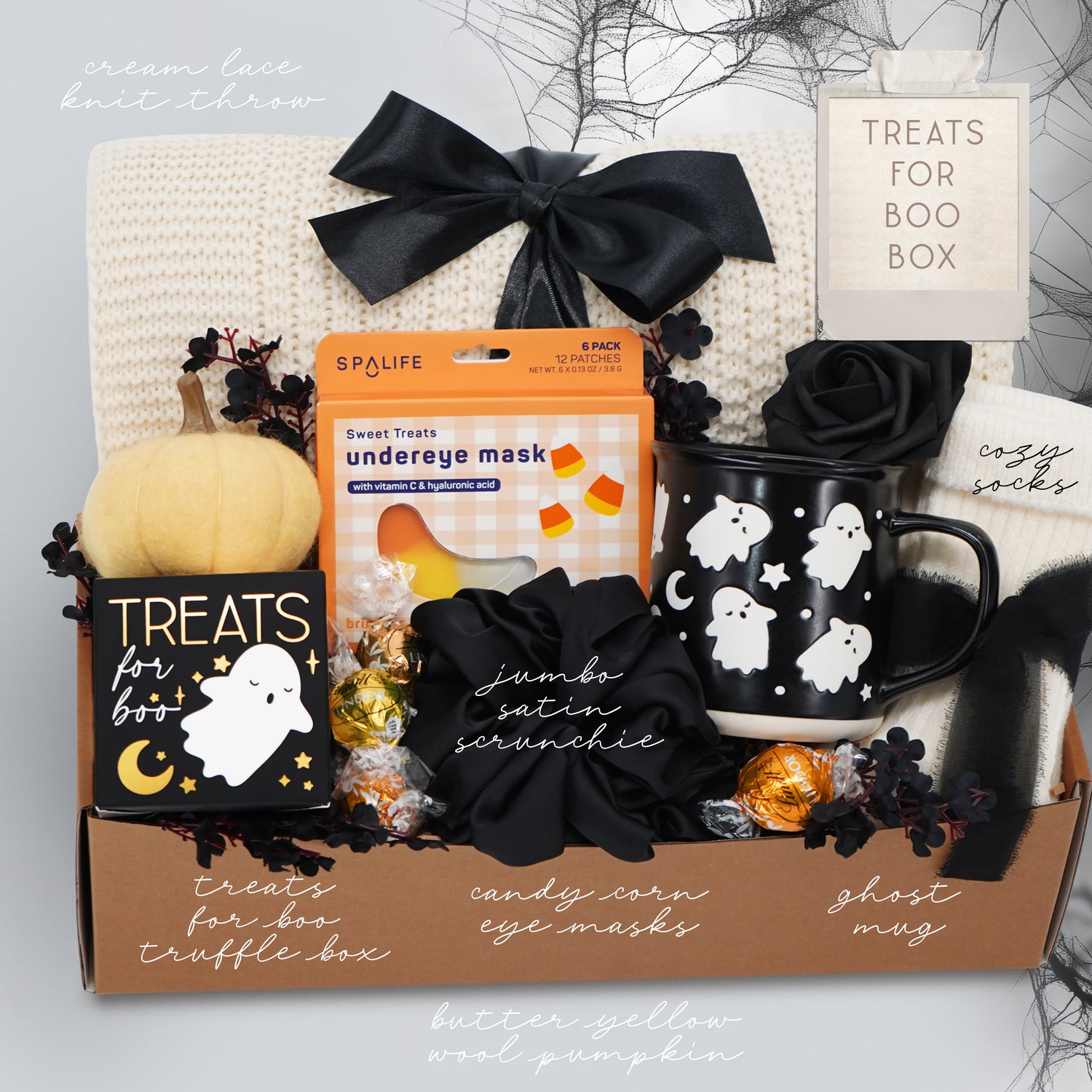 Wildflower Pop Halloween-themed boo basket with an exclusive ghost mug, candy, and decorative items on a white background.