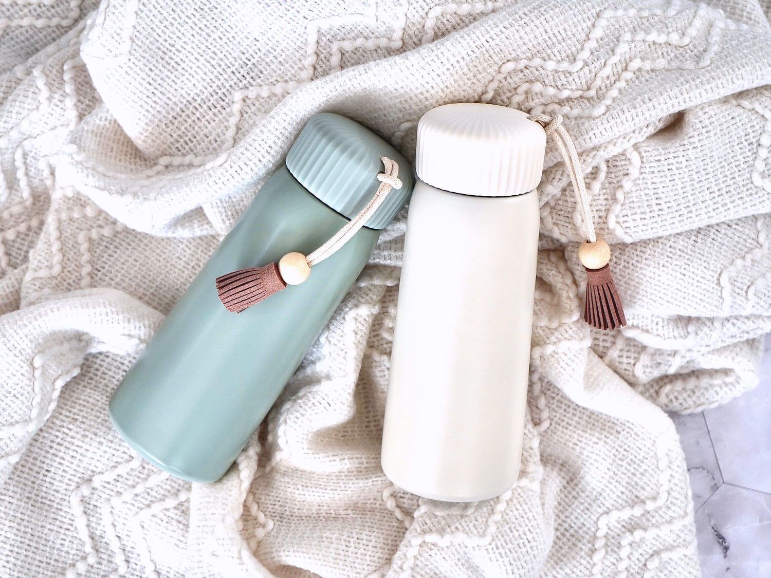 Insulated Tumbler- 13oz with lid in either sea mist green or fresh cream. Comes with tassel