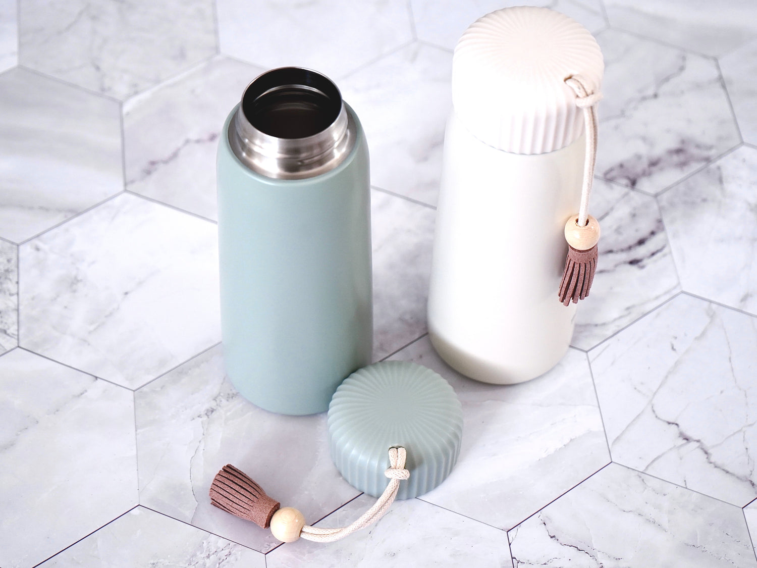 Insulated Tumbler- 13oz with lid in either sea mist green or fresh cream. Comes with tassel