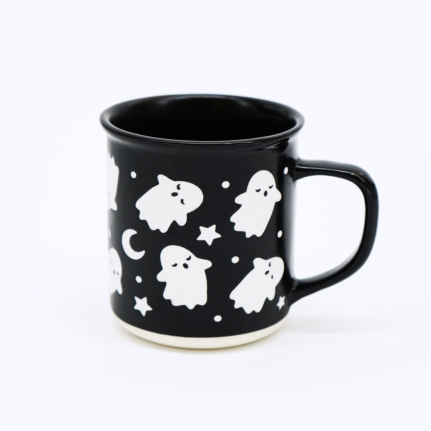 Wildflower Pop exclusive Black mug with white ghost and star pattern on a white background