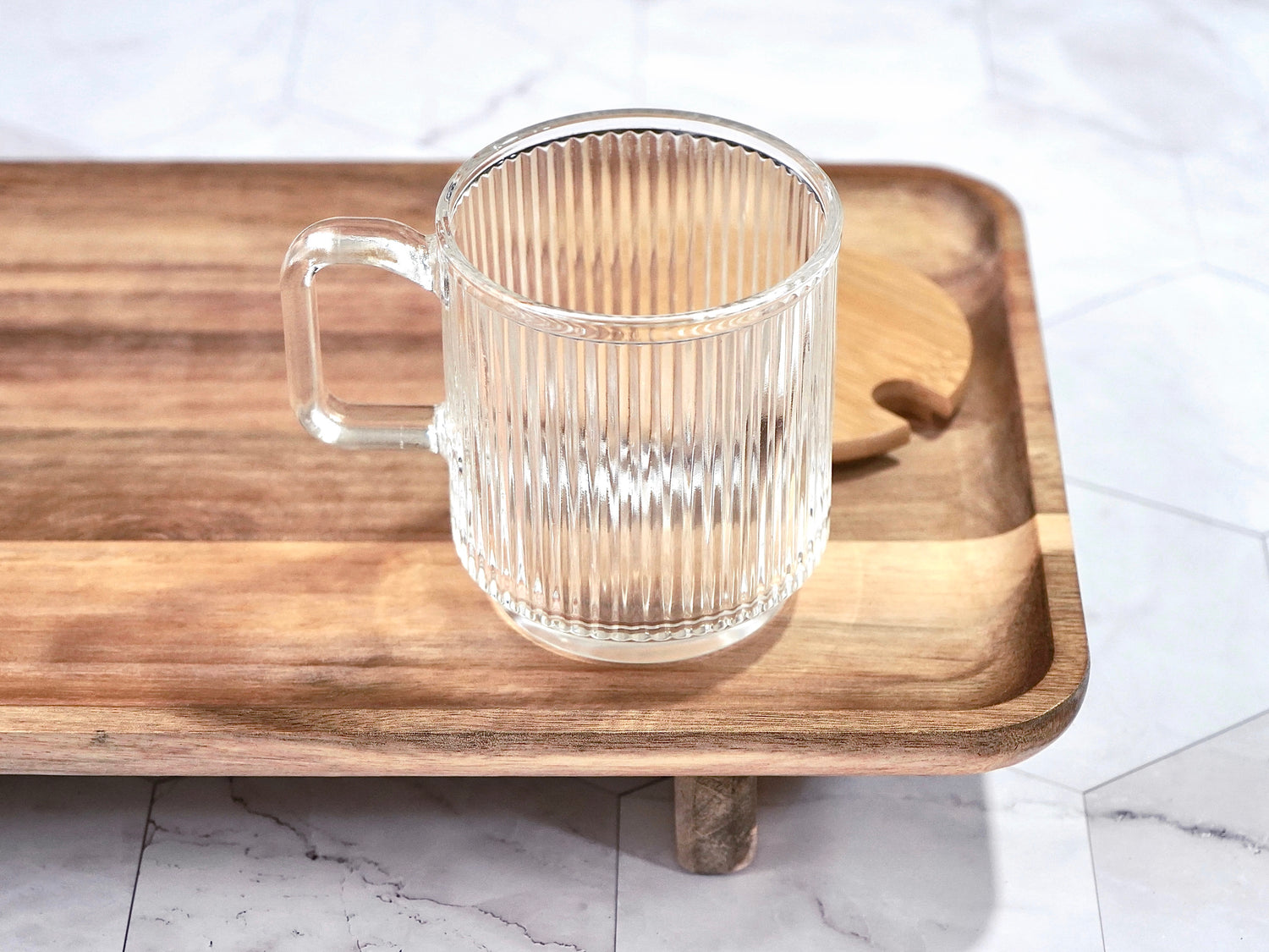 Ribbed clear glass mug shown without lid 12oz capacity