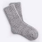 A pair of heather gray cozy boot socks shown on a clean, light gray background.