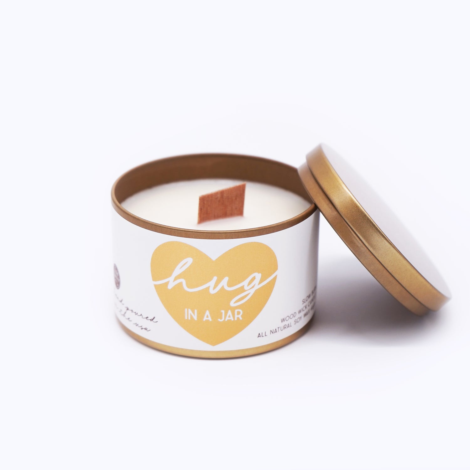 Wildflower Pop Candle jar with gold lid and 'hug in a jar' label on a white background