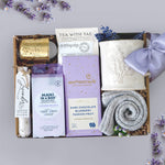 Wildflower Pop Mini Spa Day Mug Box with a ceramic lavender sprig mug, grey cozy boot socks, 2 tea bags, moonstruck dark chocolate, votive and tea light, mani in a box, and lavender bath salts