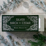 A boxed shower steamer set labeled SILVER BIRCH + CEDAR scent on a rustic wood surface.