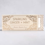 Box of sparkling ginger and mint shower steamer trio on a light gray background