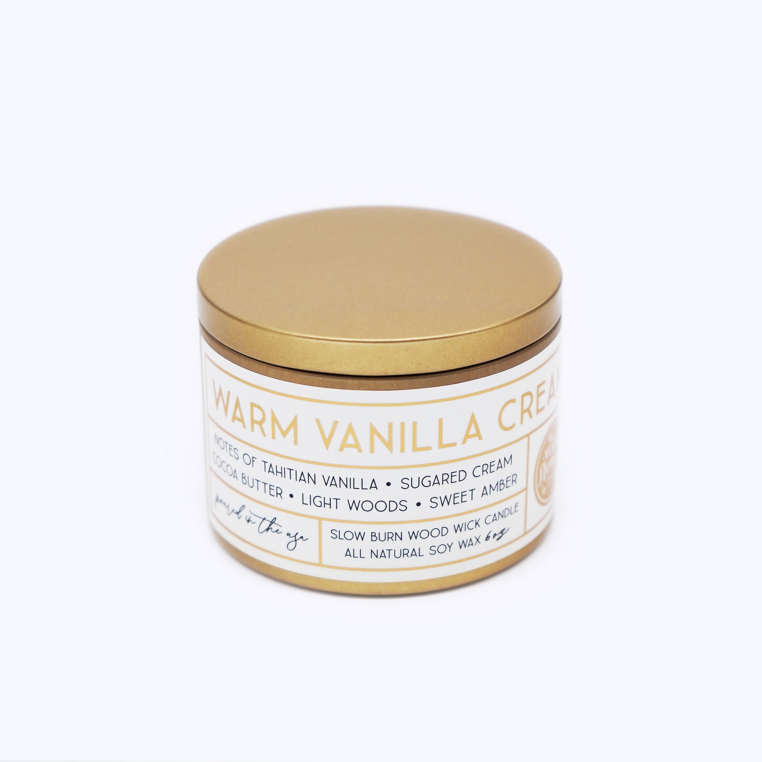 Wildflower Pop Candle jar with gold lid and white label on a white background