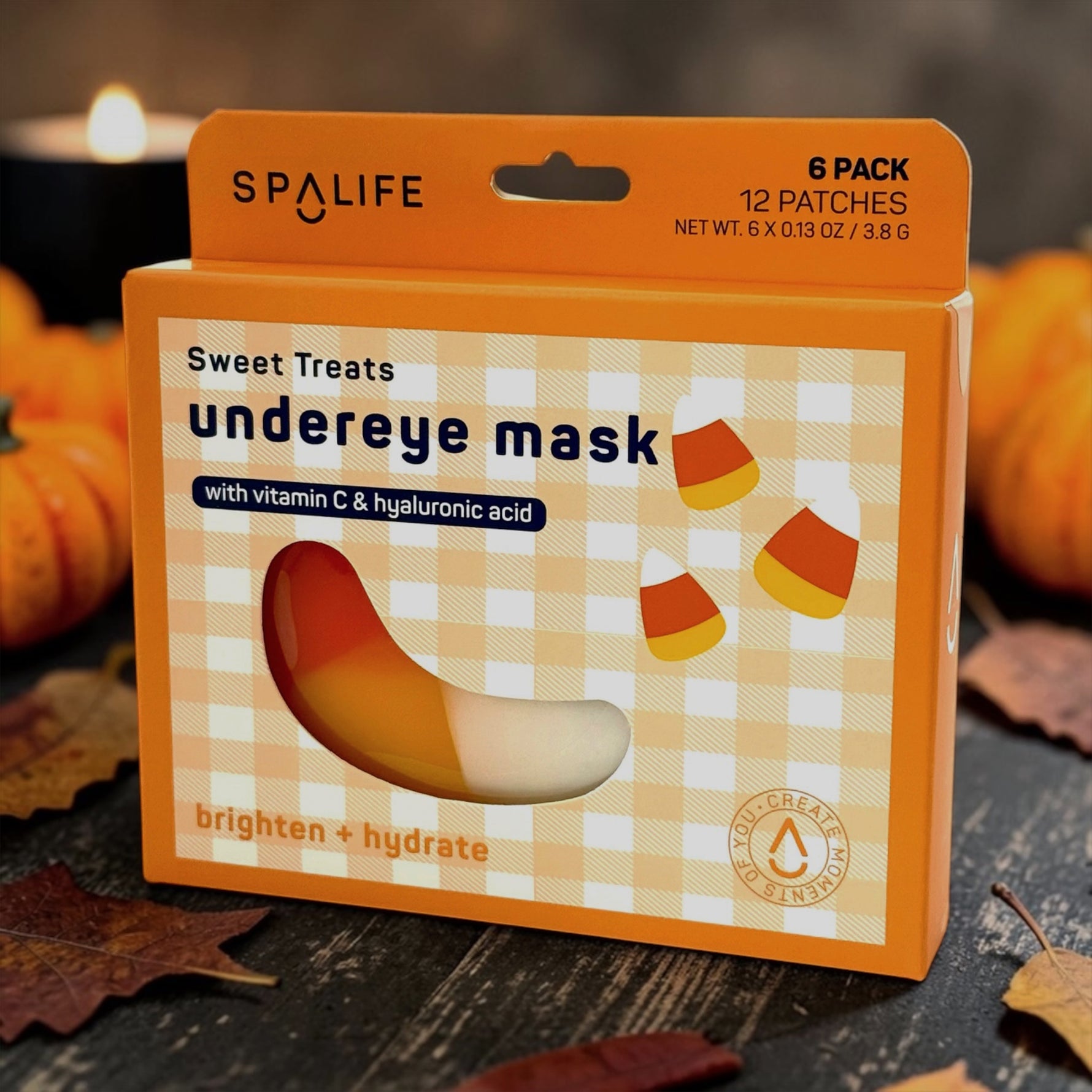 SPALIFE sweet treats undereye mask packaging with candy corn design on a wooden surface.
