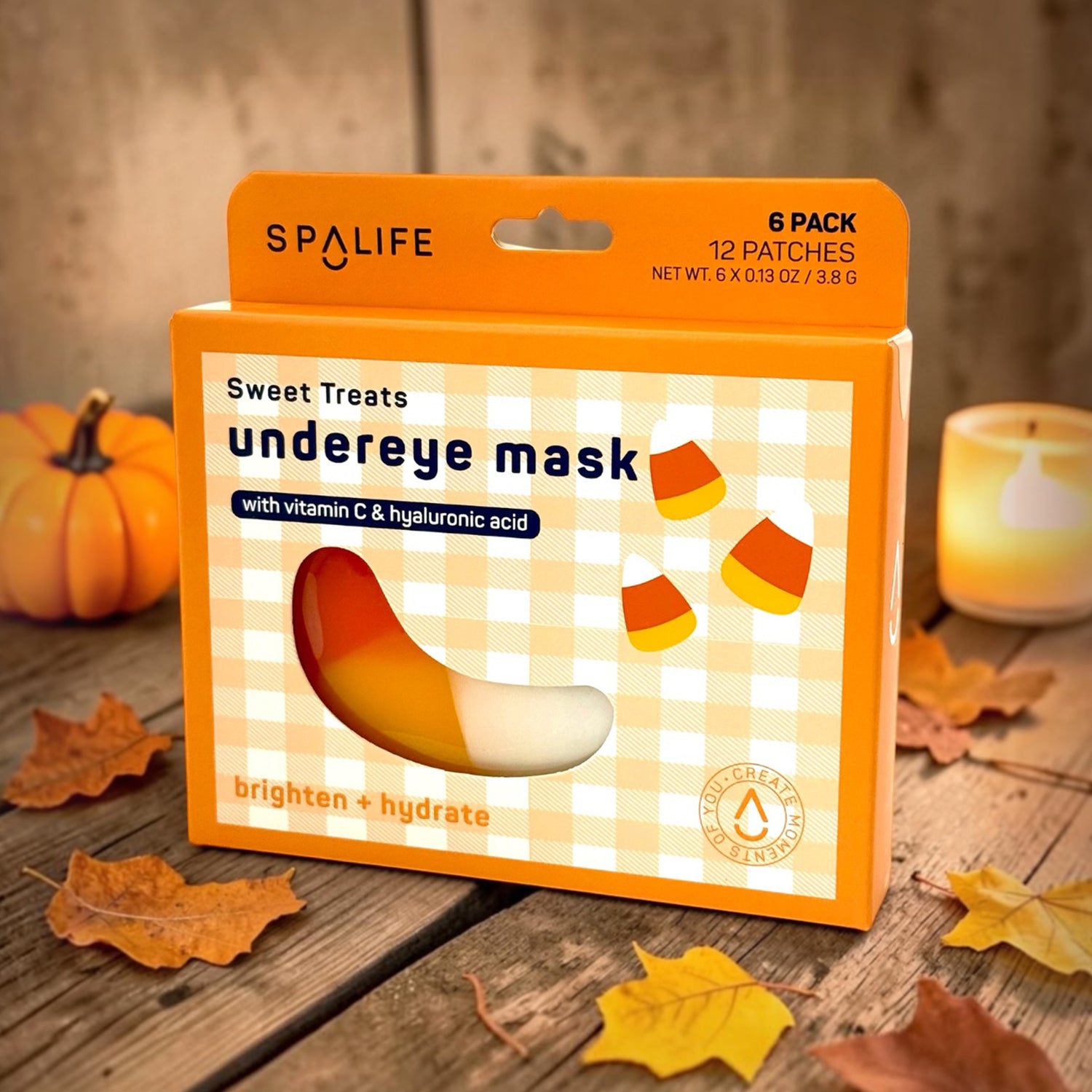 SPALIFE sweet treats undereye mask packaging with candy corn design on a wooden surface.