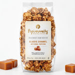 A 2.5oz bag of Popinsanity Artisanal Popcorn, Classic Caramel flavor, pictured on a white background.