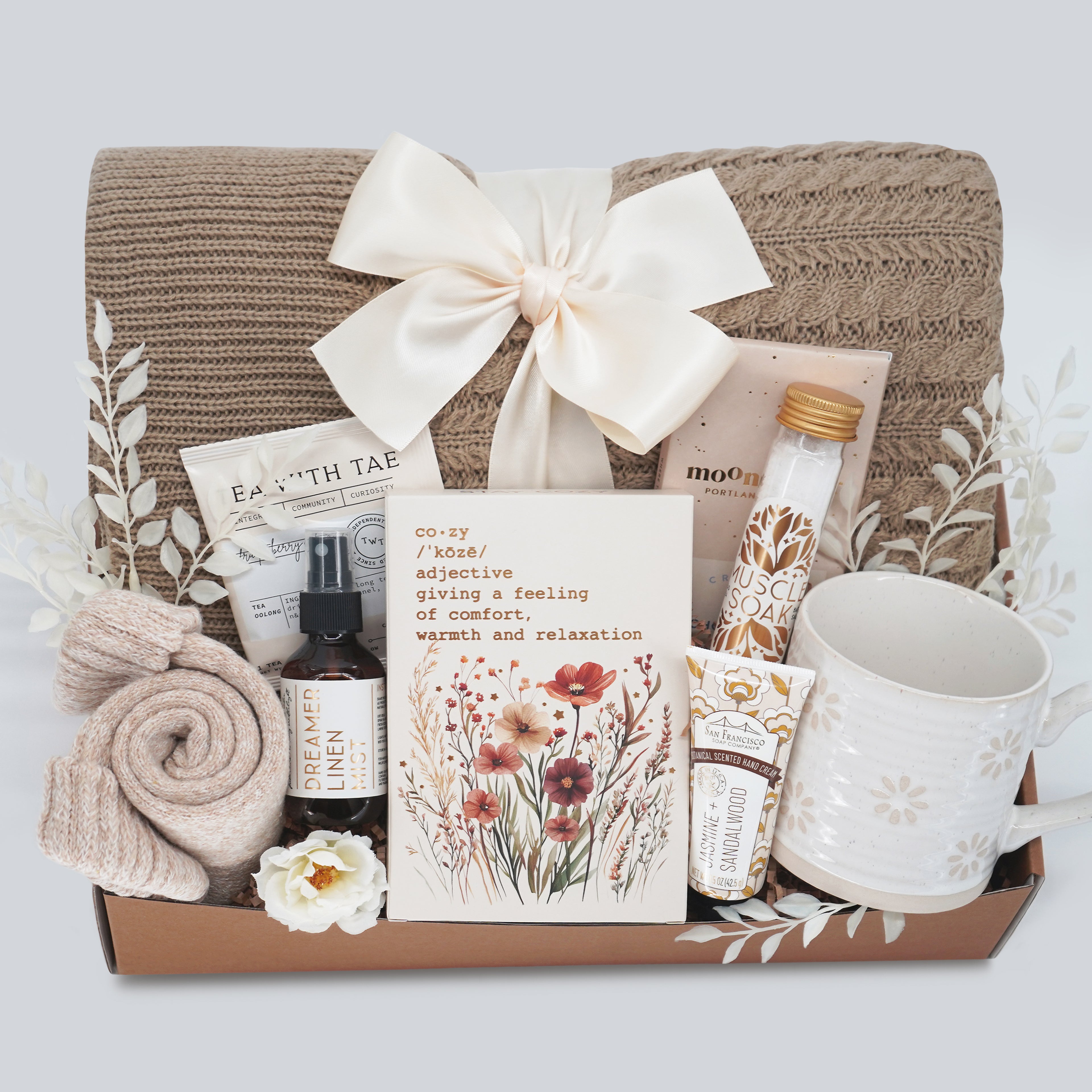 Wildflower Pop Gift box with a blanket, mug, and various items on a light gray background