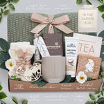 Sage green lace knit blanket tied with nude ribbon in gift box
