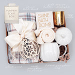 Pumpkin Scarf Box with bath bomb, candle, and other items on a light gray background
