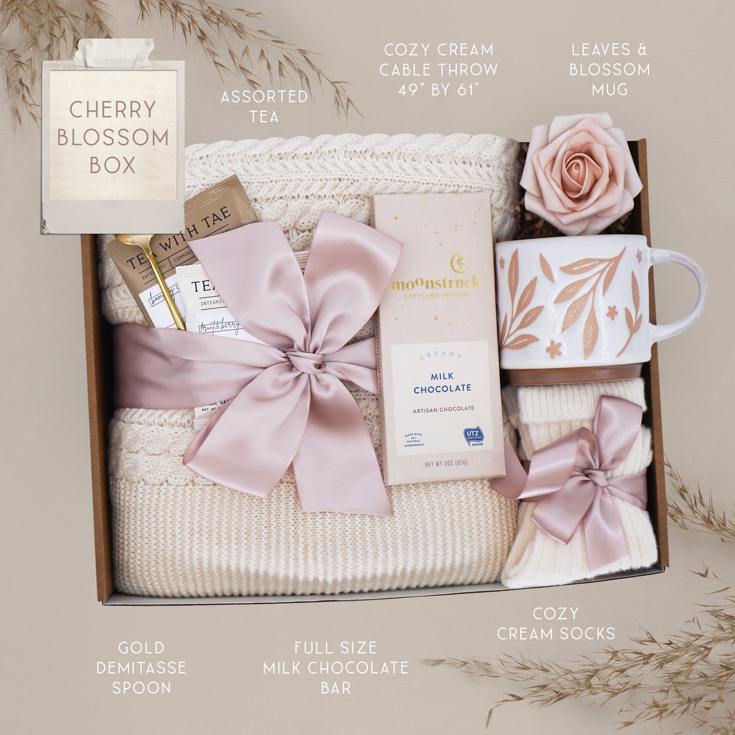 Wildflower Pop Cherry Blossom Gift box with tea, chocolate, mug, and decorative elements on a neutral background