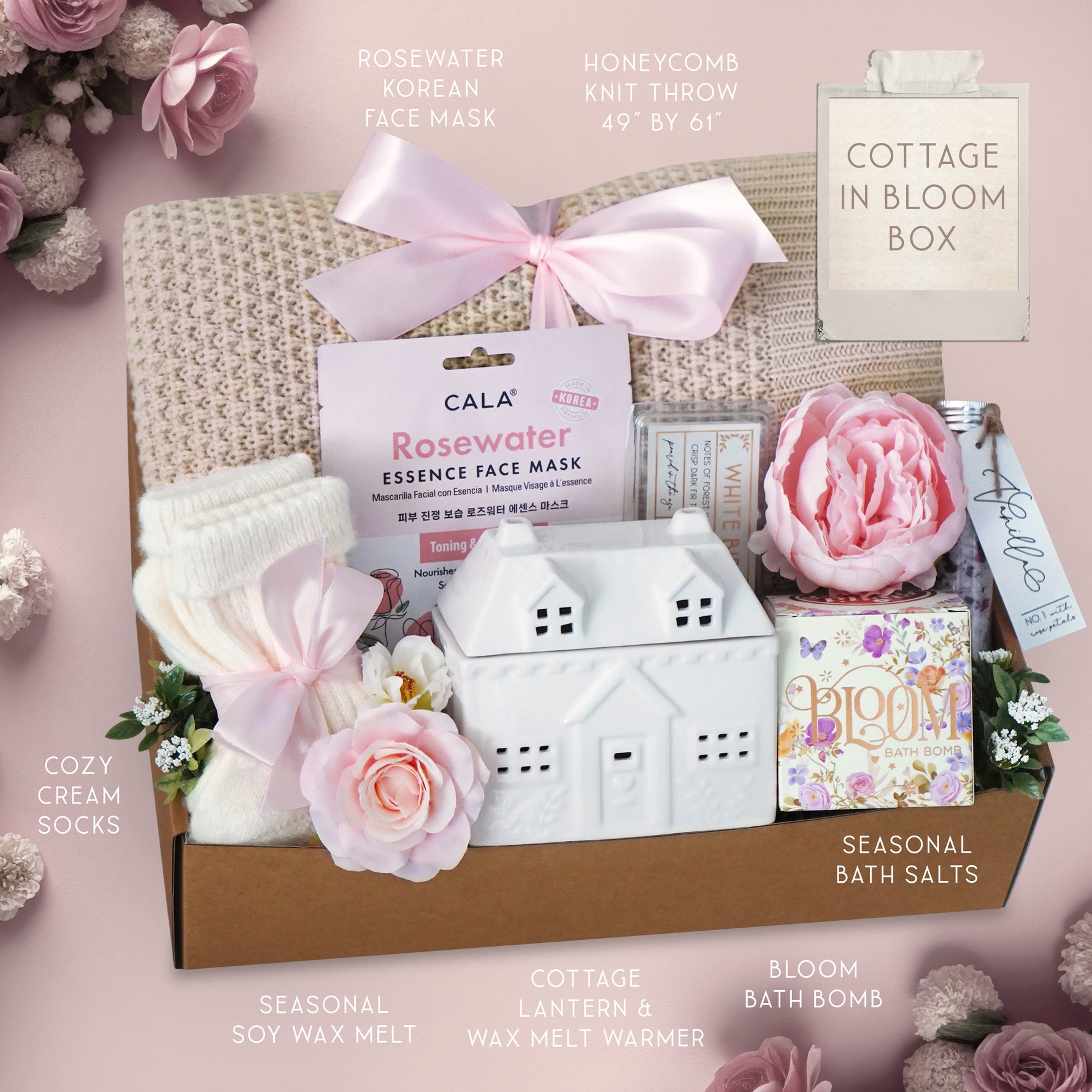Cottage-themed gift box with various items on a pink background
