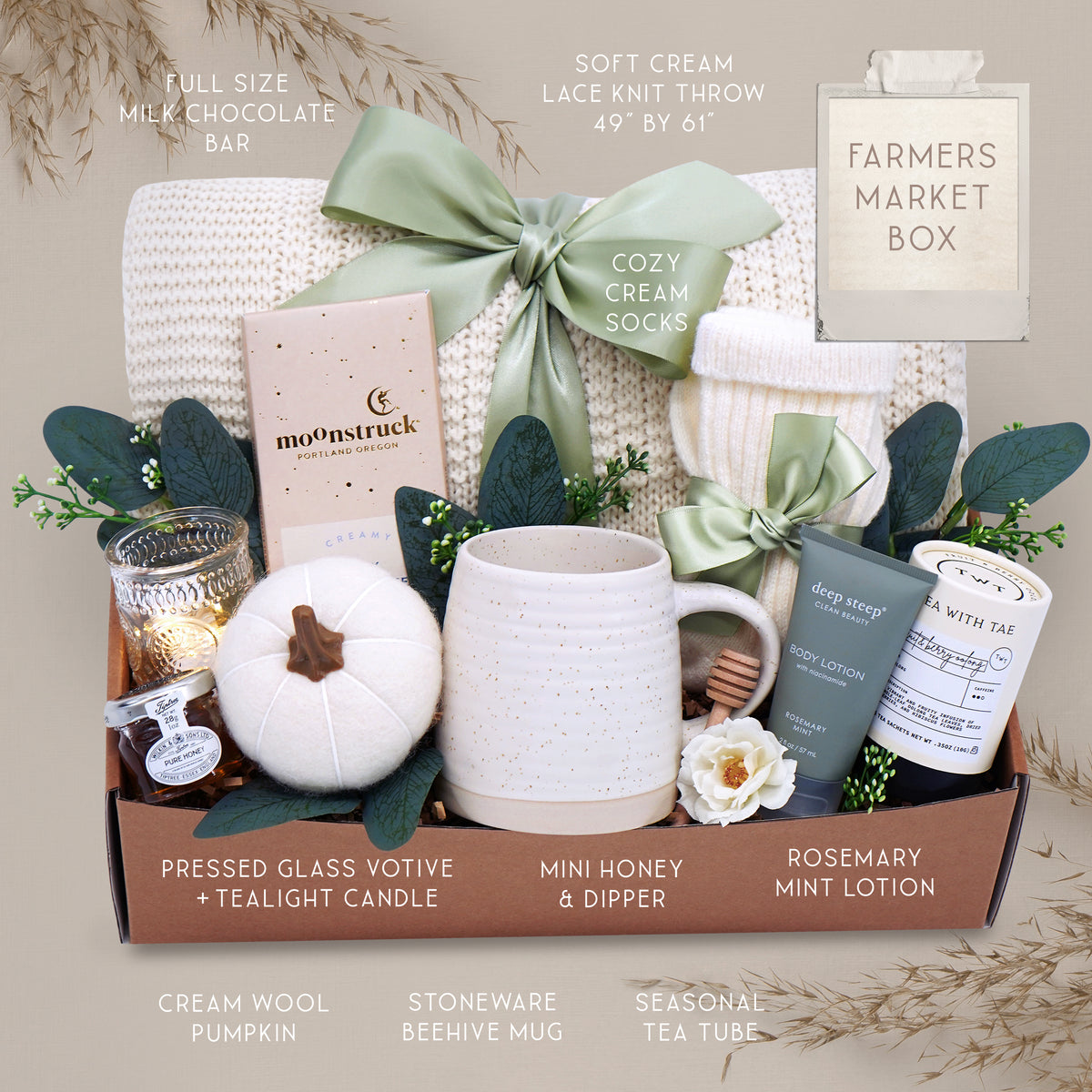 Farmers Market blanket gift box with a mug, candle, and other items on a gray background