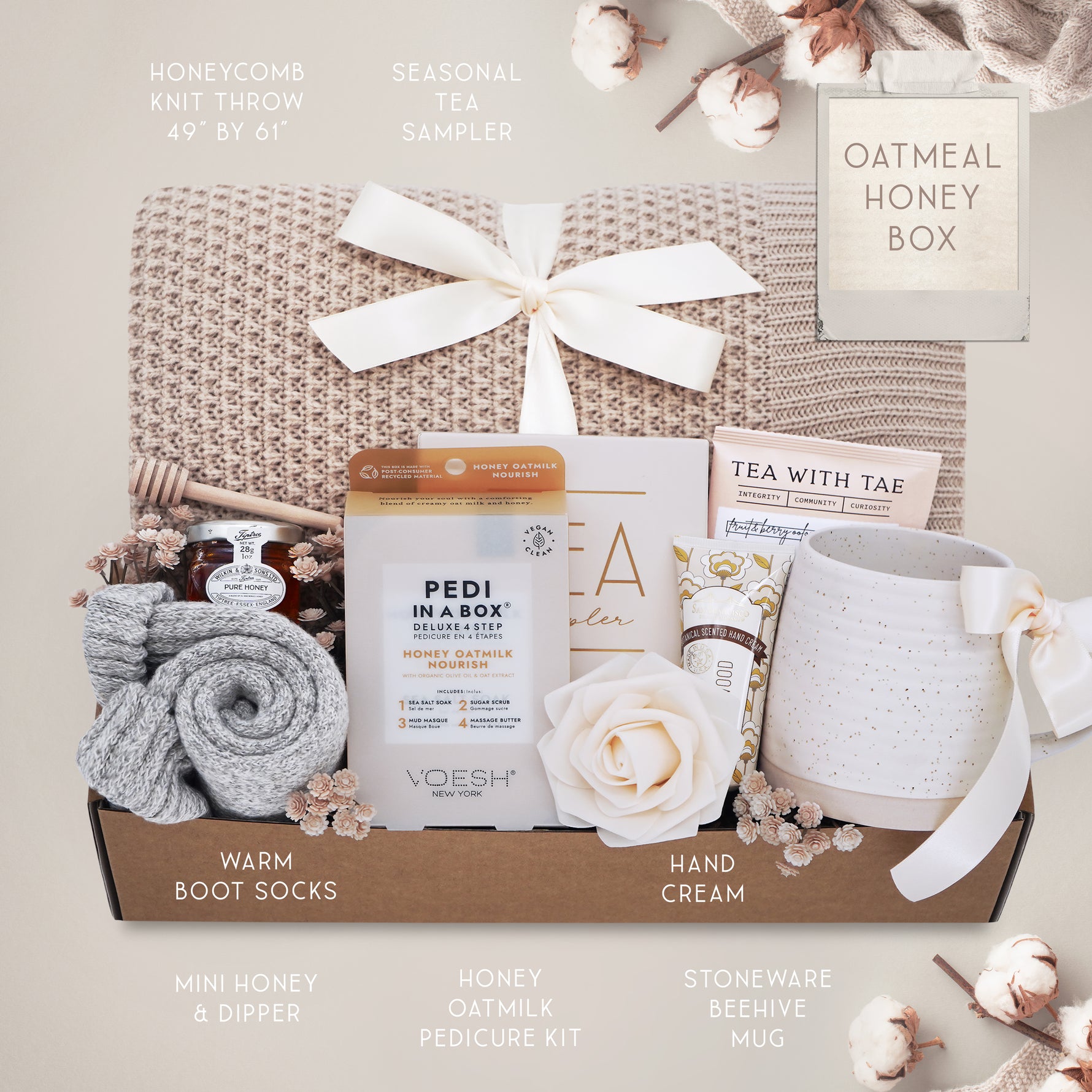 Oatmeal and Honey gift box with honeycomb blanket, tea sampler, pedi kit, grey cozy boot socks, mini honey and dipper, hand cream, and Wildflower Pop exclusive Farmhouse mug