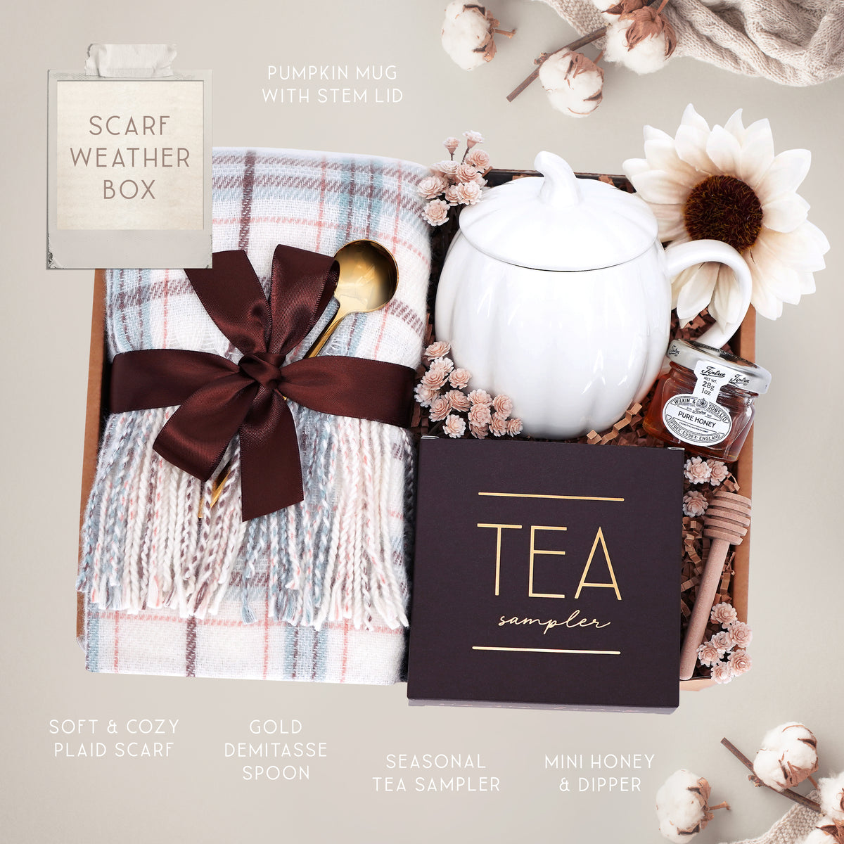Scarf Weather gift set with cozy plaid scarf, pumpkin mug, tea sampler, and mini honey and dipper on a gray background