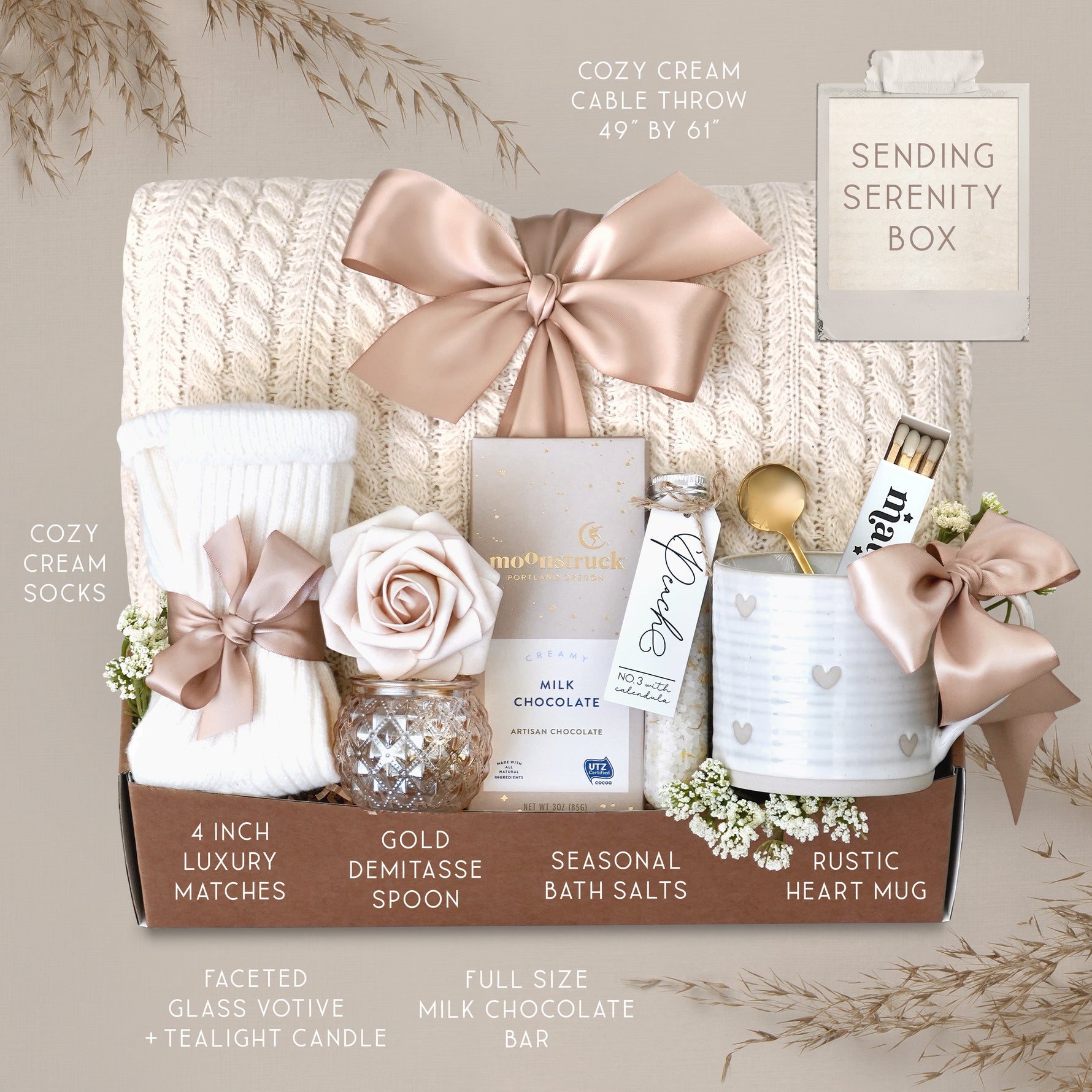 Wildflower Pop Sending Serenity Blanket Gift Box with cream cable knit blanket, moonstruck chocolate, cream knit socks, floral bath salts, Wildflower Pop ceramic heart mug, matches, votive and tea light 