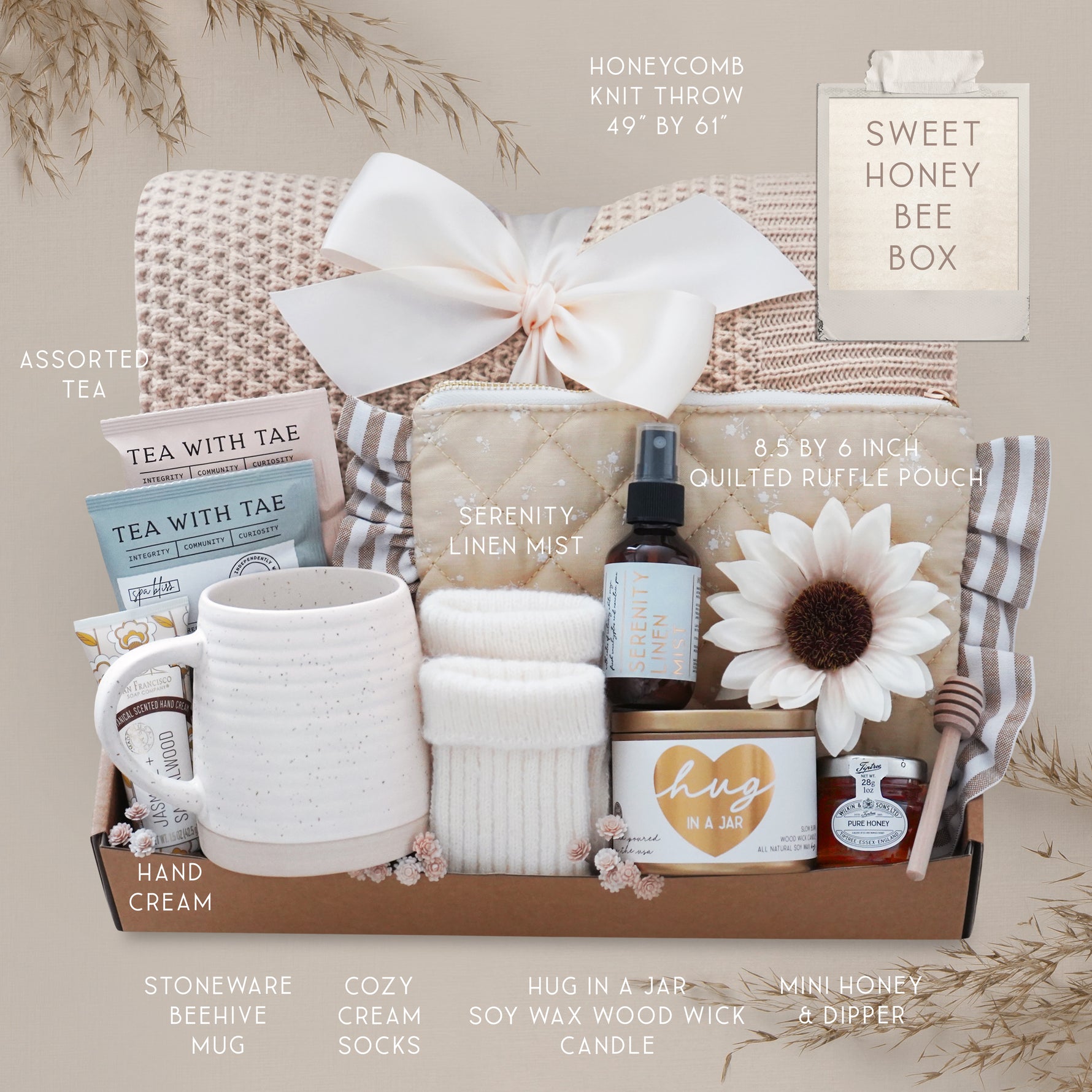 Sweet Honeybee luxury gift box featuring honeycomb knit blanket, candle, tea, mug, honey jar, socks, and self-care essentials