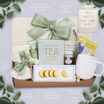 Wildflower Pop Tea Party for One comes with a cream lace knit blanket, cream knit socks, Flower Market Gardenia hand cream, Tea Sampler, Rustic Bakery shortbread cookies, ribbed white ceramic mug, mini honey and dipper