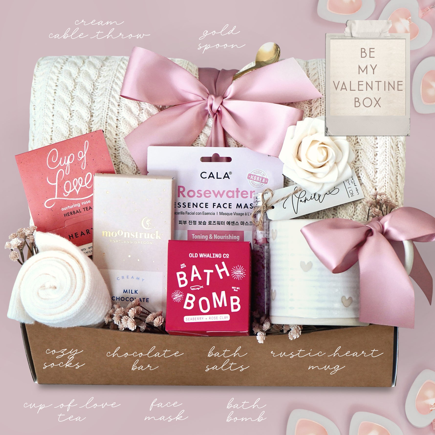 Valentine's Day gift box with various items on a pink background