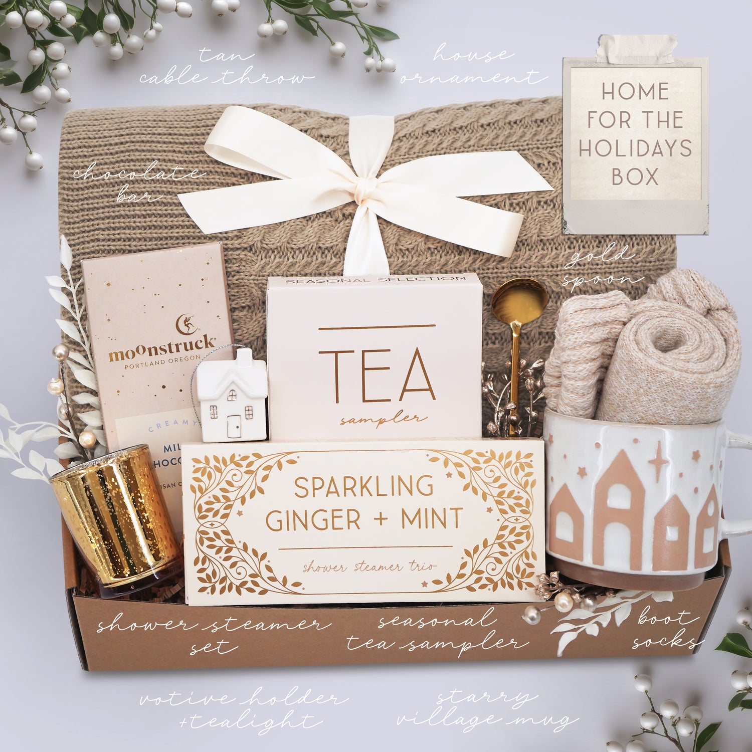 Wildflower Pop Gift basket with tea sampler, candle, and other items on a light background