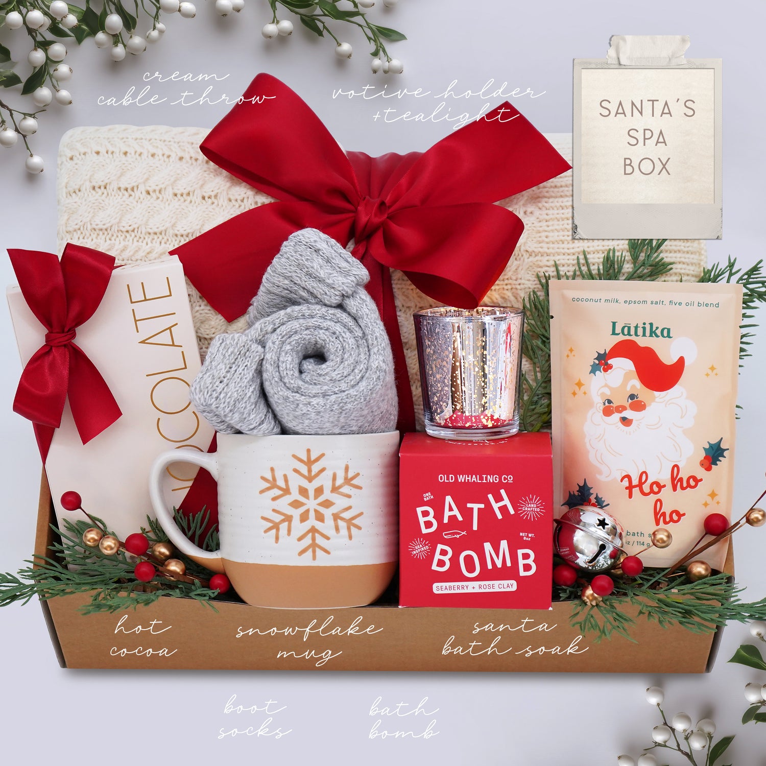 Wildflower Pop Gift basket with holiday-themed items including a mug, bath bomb, and bath salts on a white background.