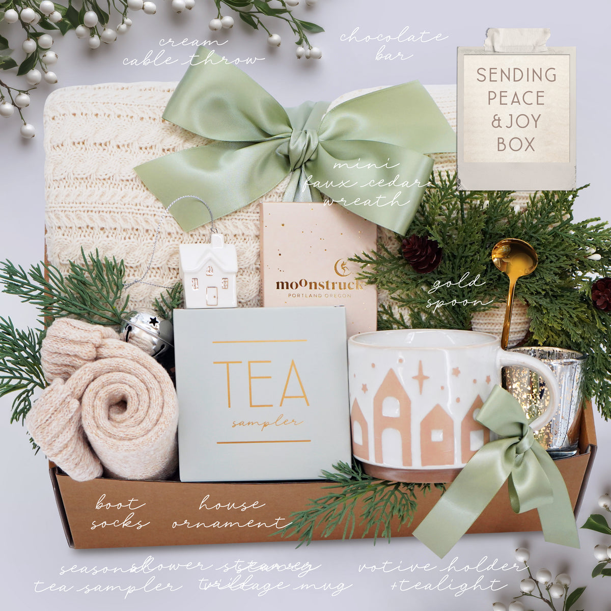Wildflower Pop Holiday Gift basket with tea, mug, and decorative items on a light background