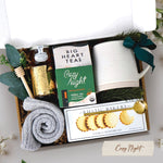 Cozy Night Gift Box comes with beehive ceramic mug, rustic bakery vanilla shortbread cookies, cozy night 10 count tea bags, mini honey and dipper, votive and tea light, and cozy socks