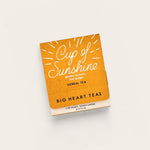 Big Heart Tea Co Cup of Sunshine Tea on beige background