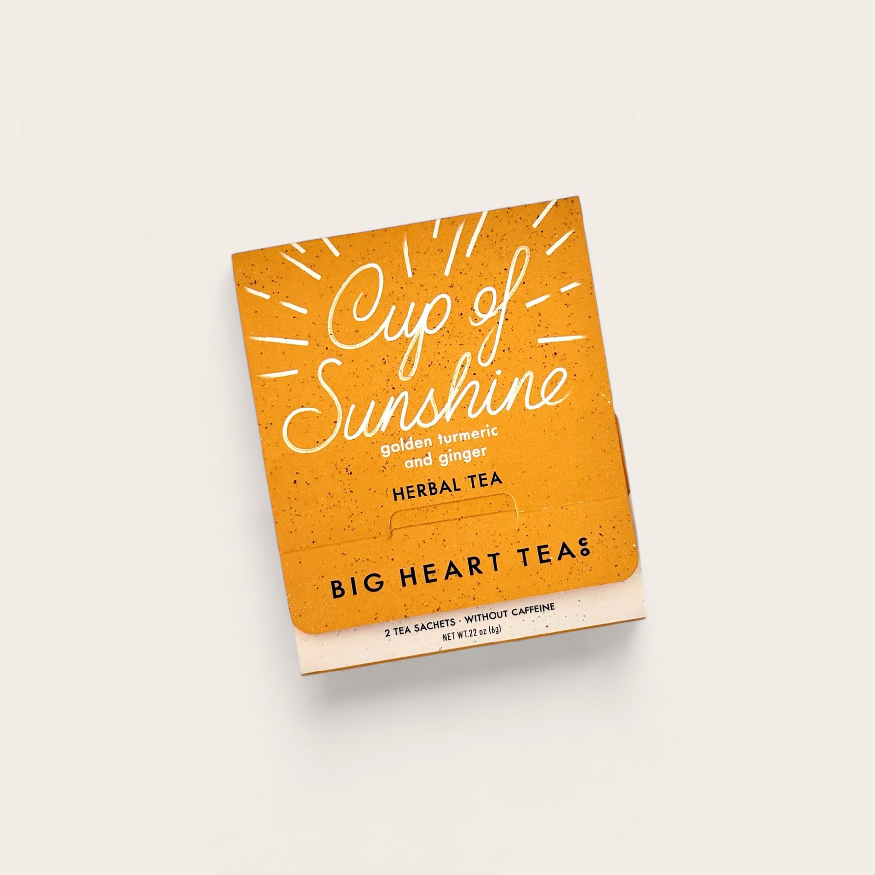 Big Heart Tea Co Cup of Sunshine Tea on beige background