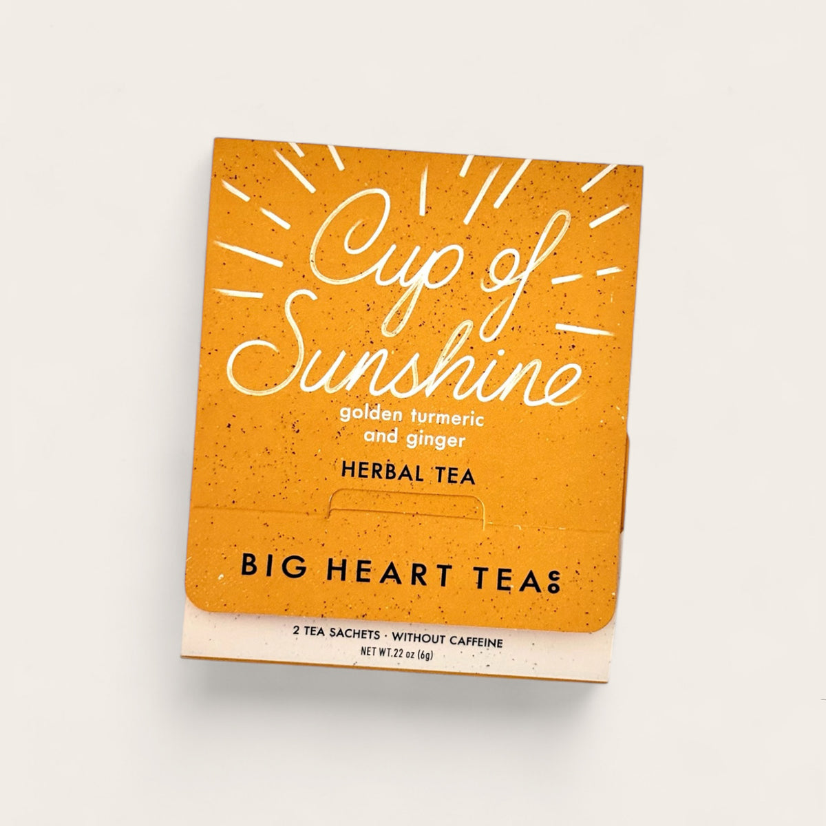 Big Heart Tea Co Cup of Sunshine Tea on beige background