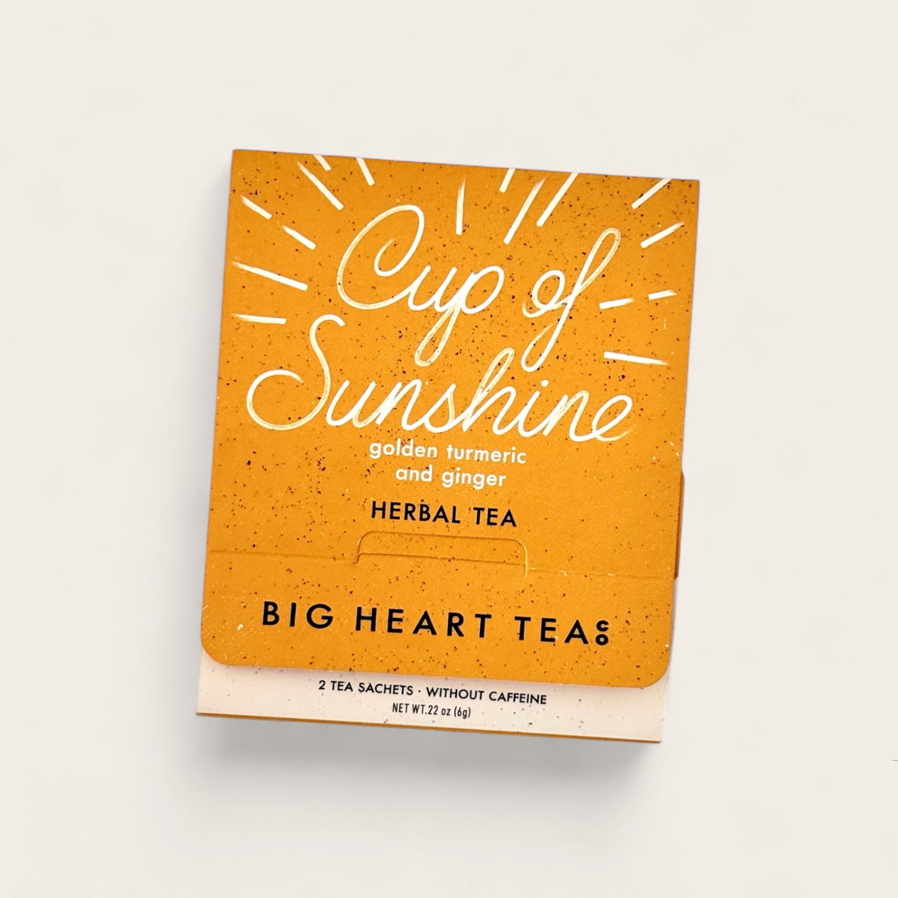 Big Heart Tea Co Cup of Sunshine Tea on beige background