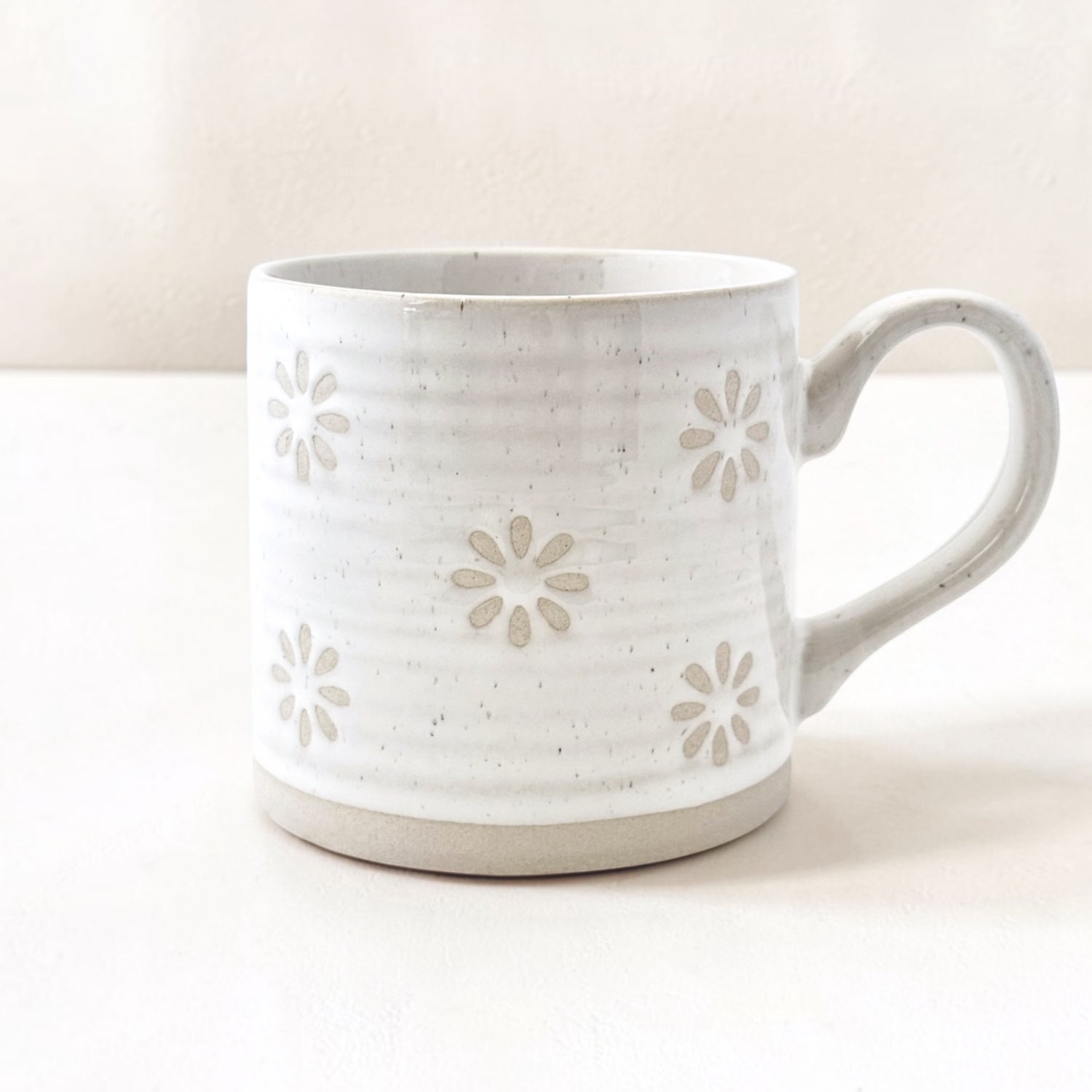 Wildflower Pop Exclusive Mug designed by us White ceramic mug with floral patterns on a white background