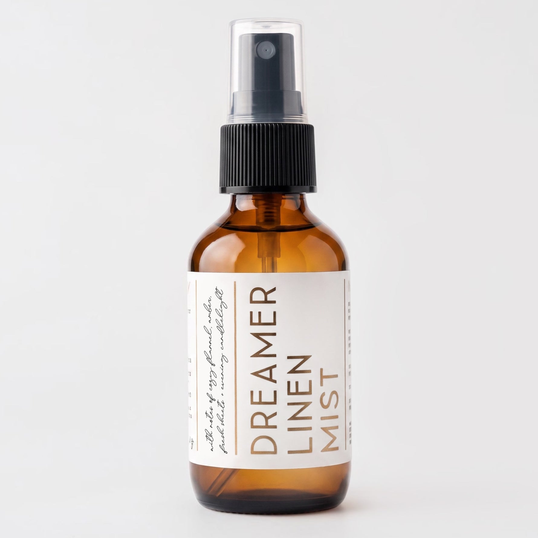 Travel size linen mist Dreamer scent on grey background.