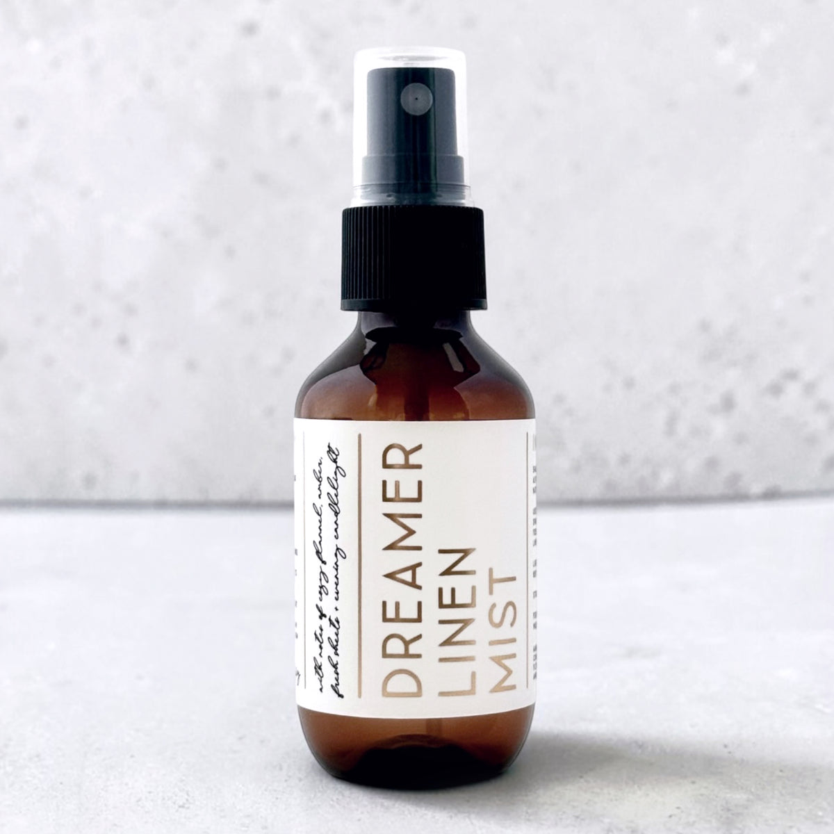Travel size linen mist Dreamer scent on grey background