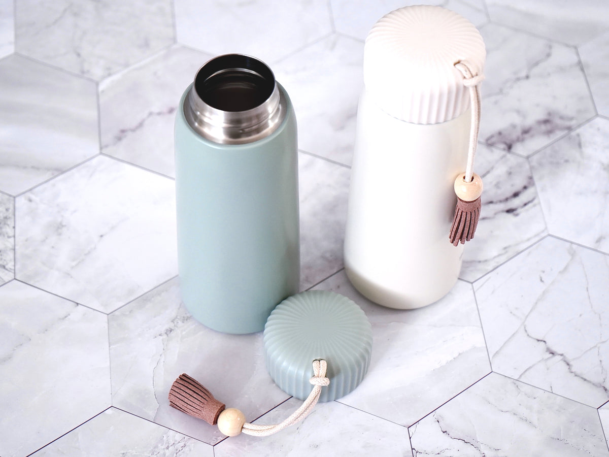 Insulated Tumbler- 13oz with lid in either sea mist green or fresh cream. Comes with tassel