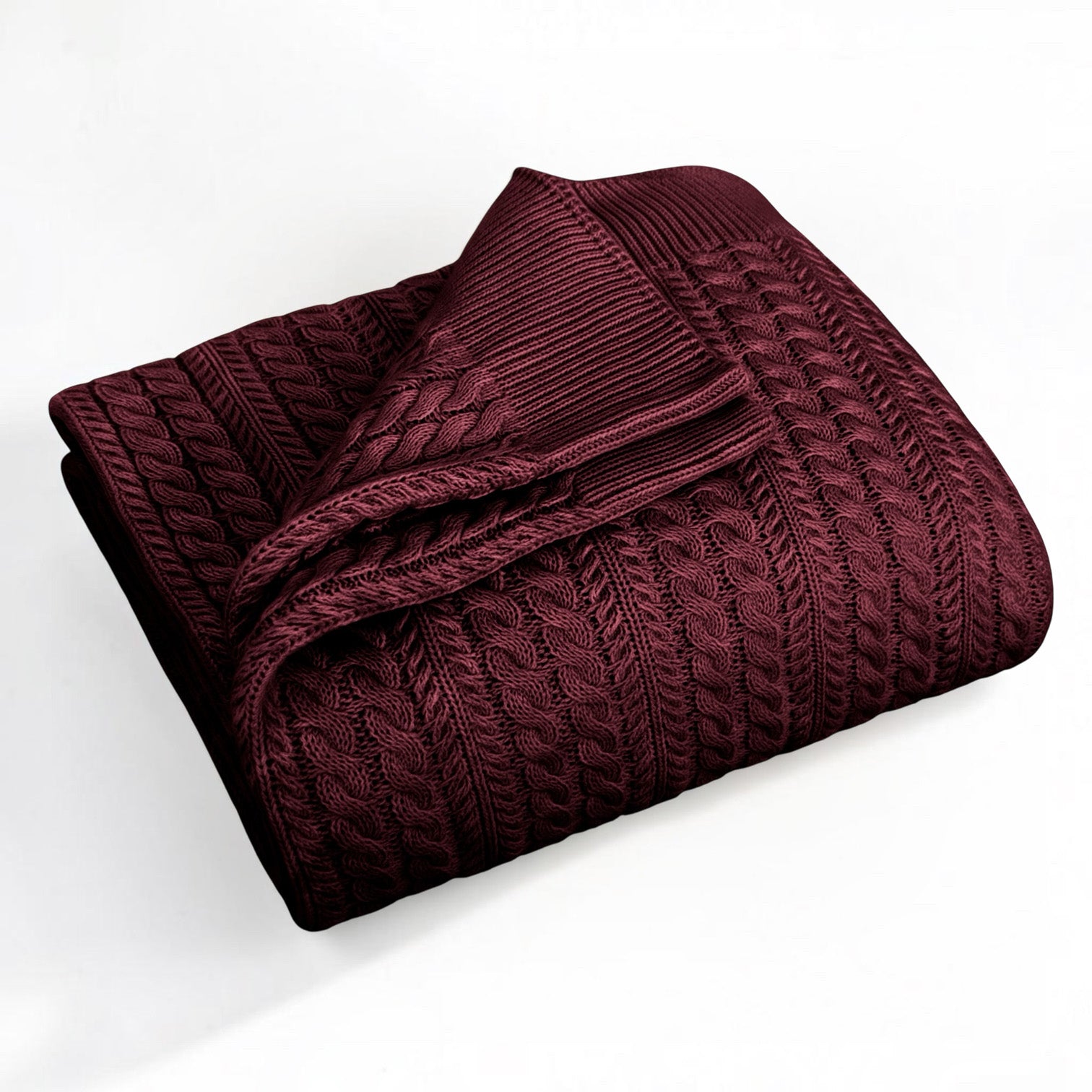 A folded burgundy-colored cable-knit blanket with a ribbed border, displayed on a clean white background.
