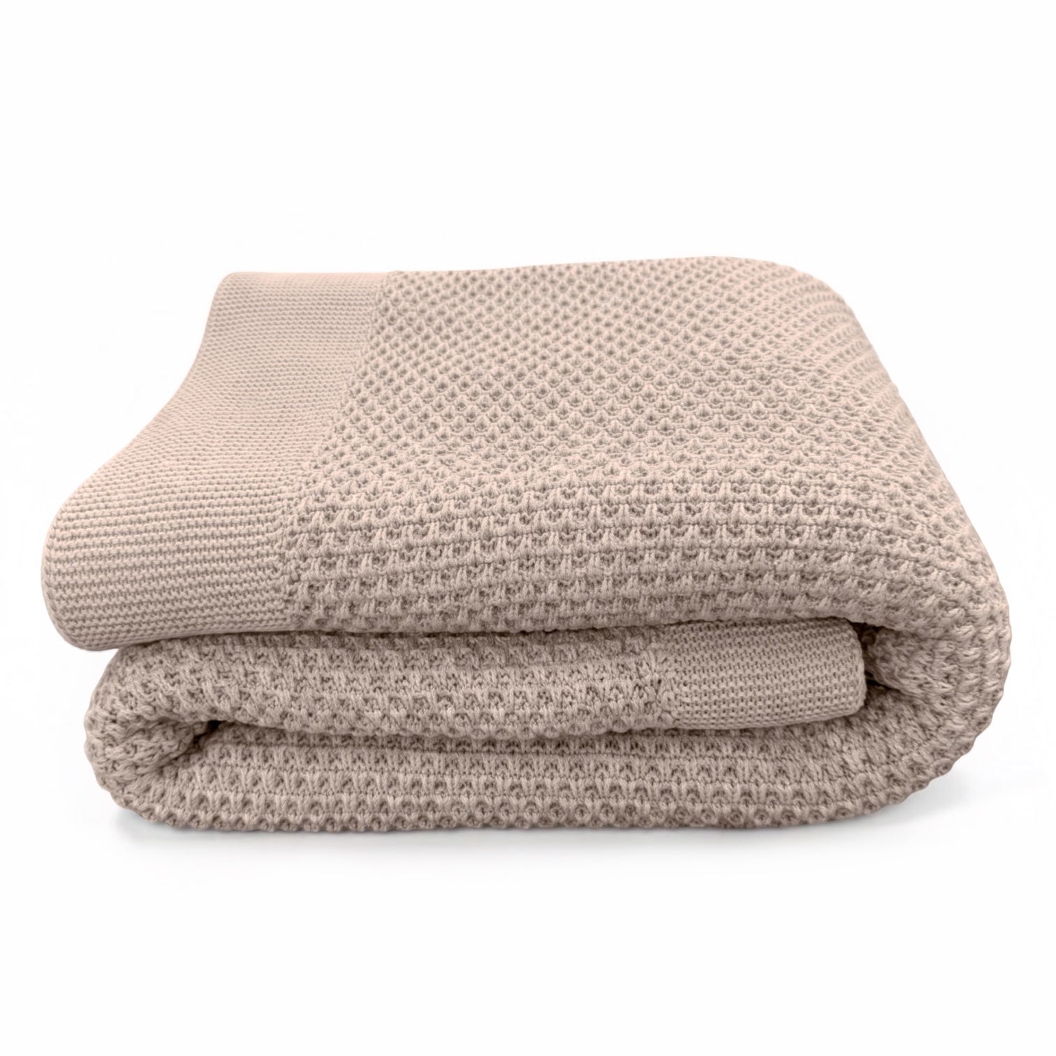 A folded honeycomb weave knit blanket in a warm taupe-beige color with a ribbed knit border, set against a plain white background.