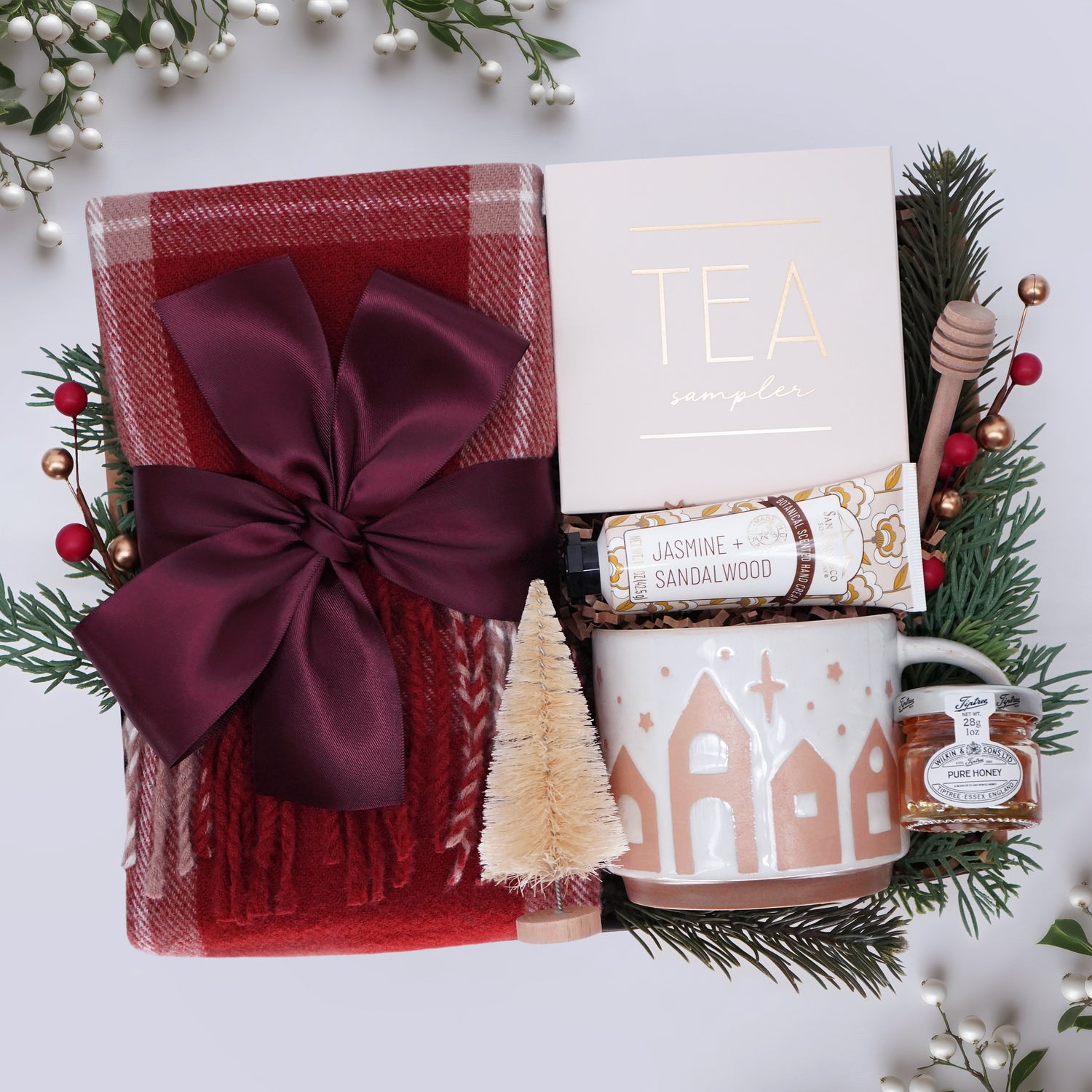 Wildflower Pop Scarf Gift set with tea, mug, and other items on a white background with decorative elements.