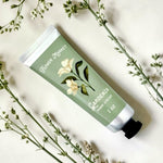 Gardenia Flower Market hand cream with floral design on a light background 