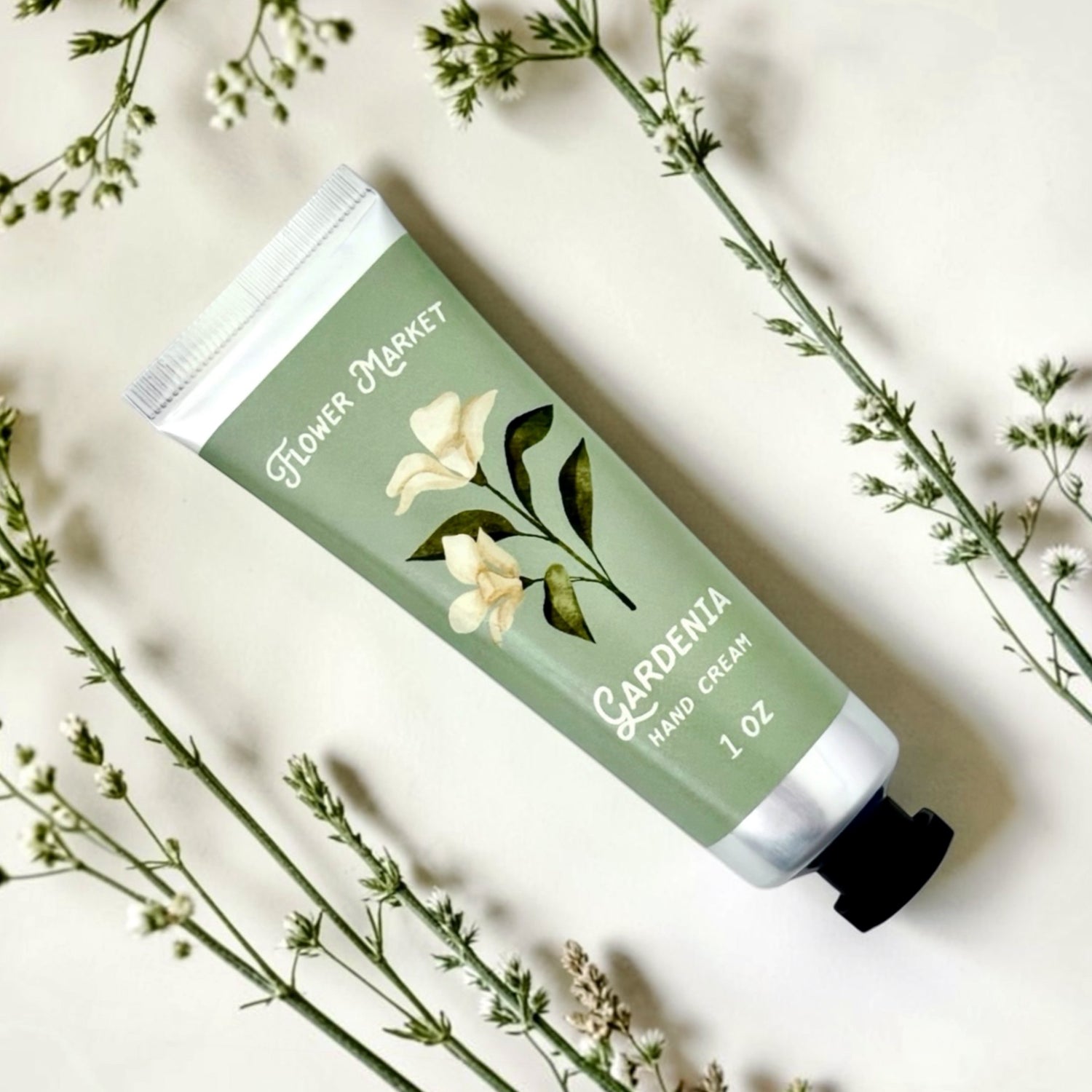 Gardenia Flower Market hand cream with floral design on a light background 