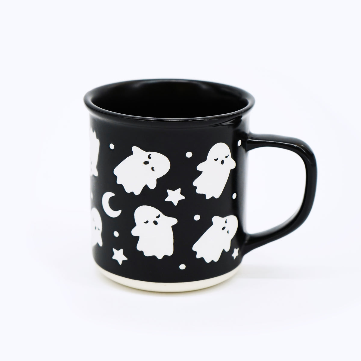 Exclusive to Wildflower Pop Black mug with white ghost and star pattern on a white background