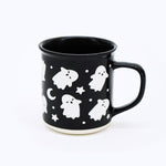 Exclusive to Wildflower Pop Black mug with white ghost and star pattern on a white background