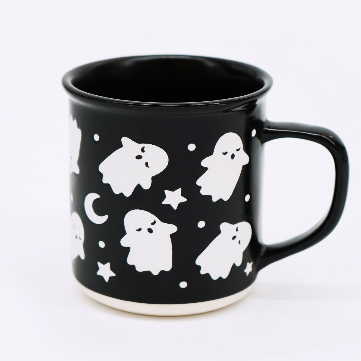 Wildflower Pop exclusive Black mug with white ghost and star pattern on a white background