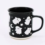 Wildflower Pop exclusive Black mug with white ghost and star pattern on a white background