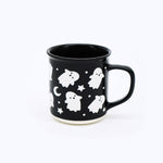 Wildflower Pop exclusive Black mug with white ghost and star pattern on a white background