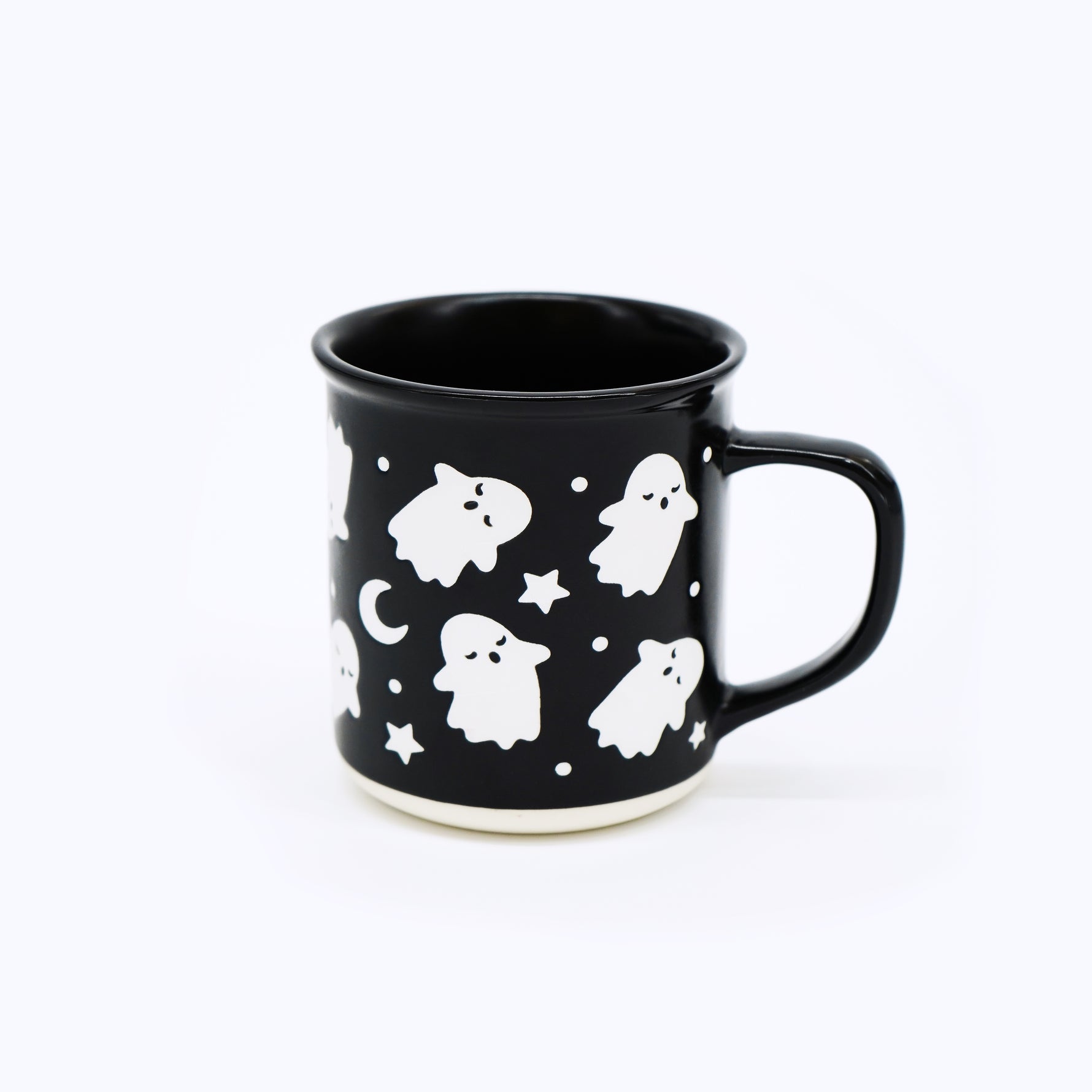 Wildflower Pop exclusive Black mug with white ghost and star pattern on a white background